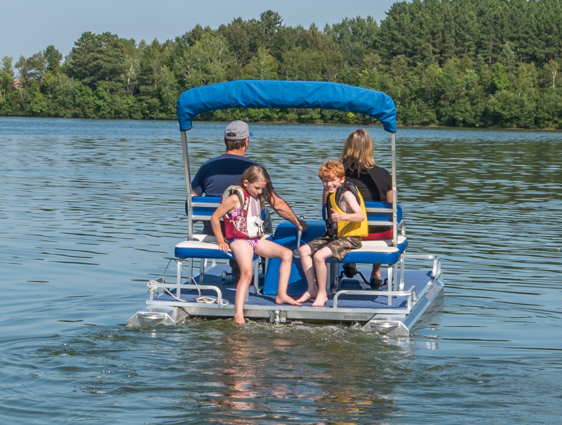 Family of four on a paddle boat on Shagawa
