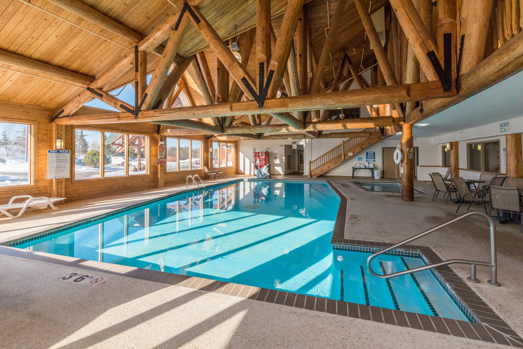 Wide-angle view of Grand Ely Lodge indoor pool during winter.