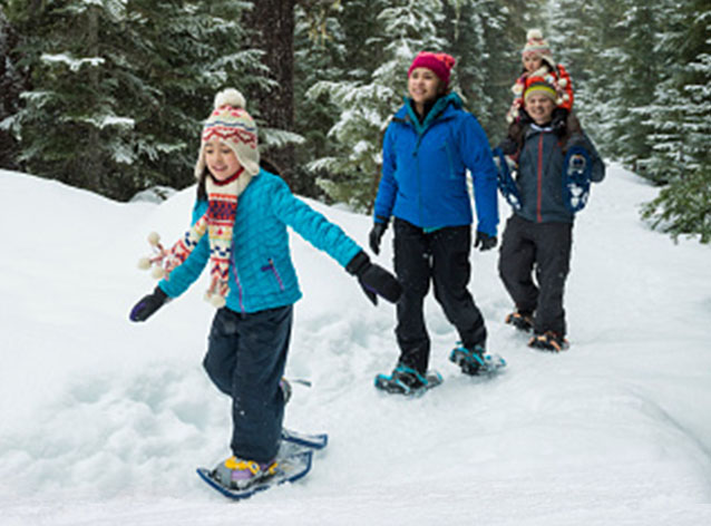A boat sits at a dock during sunset